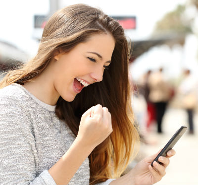 woman excited about her smartphone